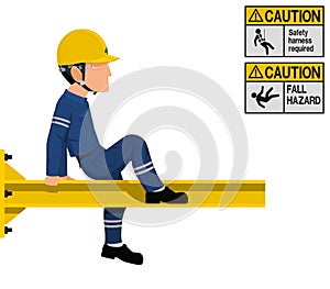An industrial worker is working at height