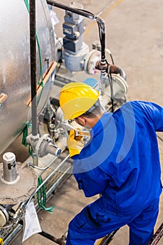 Industrial worker working at machine