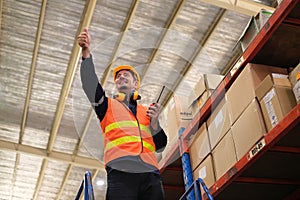 Industrial worker working at warehose factory