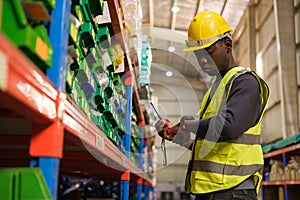 Industrial worker working at warehose factory