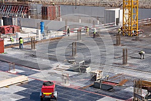 Industrial workers preparing construction formwork