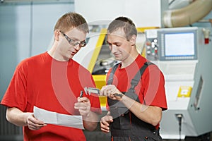 Industrial workers at tool workshop