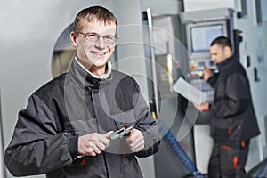 Industrial workers at tool workshop