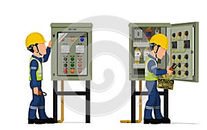 Industrial workers use clamp meter to measuring electric current in the electrical control cabinet