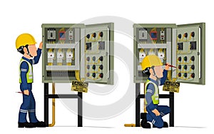 Industrial workers use screwdriver tester to measuring electric current in the electrical control cabinet