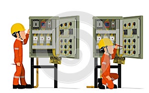 Industrial workers use screwdriver tester to measuring electric current in the electrical control cabinet