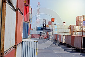 Industrial yard for Logistic Import Export business. Forklifts handling containers. shipping container Logistics yard with product