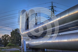 Industrial zone. Close-up of industrial pipelines of an oil-refinery plant