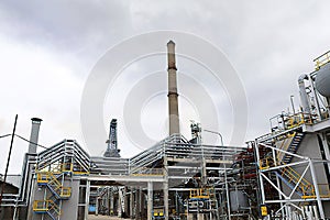 Industrial zone, the equipment of oil refining, industrial pipelines of an oil and gas plant.