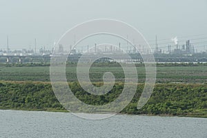 Industrial zone with factories and refineries observed from the container terminal of the Port of Houston.