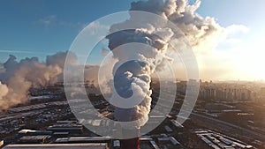 Industrial zone with a large red and white pipe, aerial view