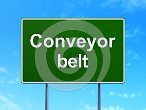 Industry concept: Conveyor Belt on road sign background