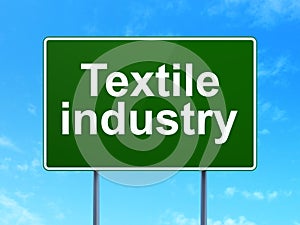 Industry concept: Textile Industry on road sign background