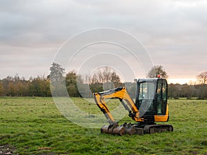 Industry construction environment yellow digger machine parked o