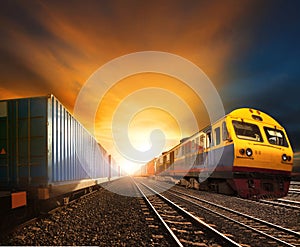 industry container trainst running on railways track against beautiful sun set sky use for land transport and logistic business