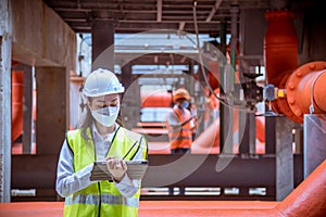 Industry engineer under checking the industry cooling tower air conditioner is water cooling tower air chiller HVAC of large indus