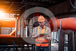 Industry engineer under checking the industry cooling tower air conditioner is water cooling tower air chiller HVAC of large indus