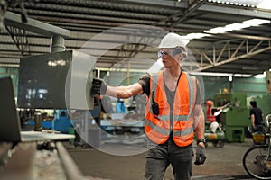 Industry engineer worker operate control heavy machine in factory.