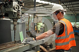 Industry engineer worker operate control heavy machine in factory.