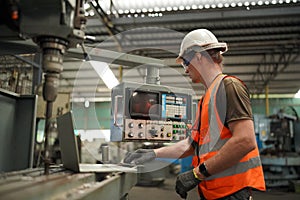 Industry engineer worker operate control heavy machine in factory.