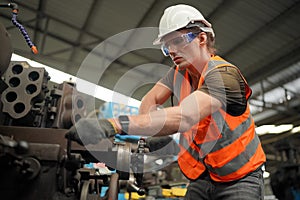 Industry engineer worker operate control heavy machine in factory.