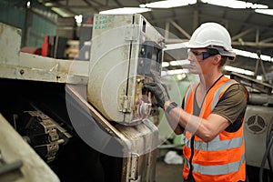 Industry engineer worker operate control heavy machine in factory.