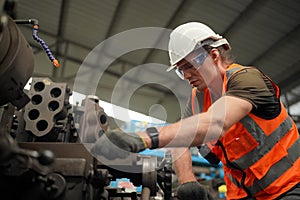 Industry engineer worker operate control heavy machine in factory.