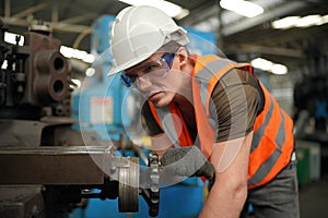 Industry engineer worker operate control heavy machine in factory.