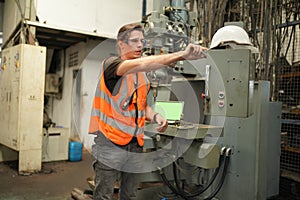 Industry engineer worker operate control heavy machine in factory.