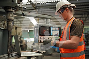 Industry engineer worker operate control heavy machine in factory.