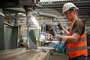 Industry engineer worker operate control heavy machine in factory.