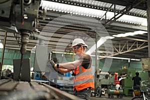 Industry engineer worker operate control heavy machine in factory.