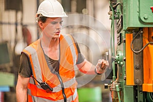 Industry engineer worker operate control heavy machine in factory.