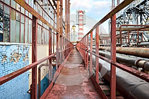 Industry highway walkway platform with grate and handrail on petrochemical plant factory with lighting masts and explosion-proof