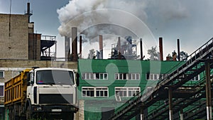 Industry, industry and ecology problem. Dark smoke of the peat plant polluties the environment