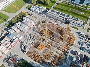 Industry with low carbon footprint. Industrial warehouses with solar panels on the roof. Technology park and factories from above