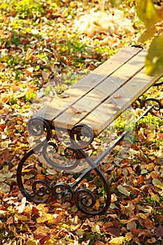 Industry making a forging bench in the fall in the garden in the foliage under the tree. Autumn garden background
