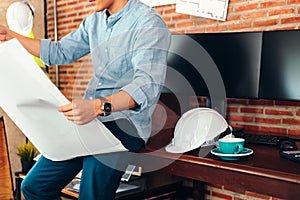Industry manager, engineer, businessman reading and checking blueprint, drawing  in the room. Engineer plan architecture concept