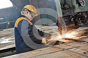 Industry worker at spot welding machine