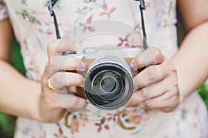 Indy women hold mirrorless camera retro vintage