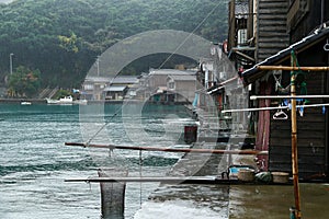 Ine Boathouse is traditional Fisherman Village on a rainy day of Kyoto.