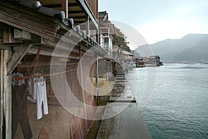 Ine Boathouse is traditional Fisherman Village on a rainy day of Kyoto.