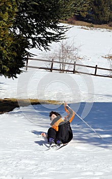 inexperienced young boy trying for the first time the cross-country skiing