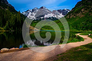 Infamous Maroon Bells of Aspen Colorado with Walking Path and reflection photo