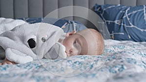 infancy, childhood, development, medicine and health concept - close-up face of sweaty newborn chubby sleeping baby 10