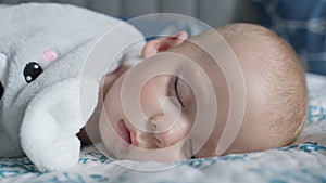 infancy, childhood, development, medicine and health concept - close-up face of sweaty newborn chubby sleeping baby 10
