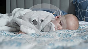 infancy, childhood, development, medicine and health concept - close-up face of sweaty newborn chubby sleeping baby 10