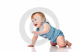Infant child baby boy crawling and happy looking, isolated on a white background.