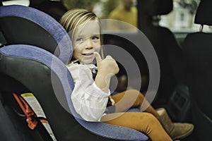 Infant baby girl in car seat ready to go