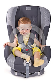 Infant baby girl sitting in a car seat